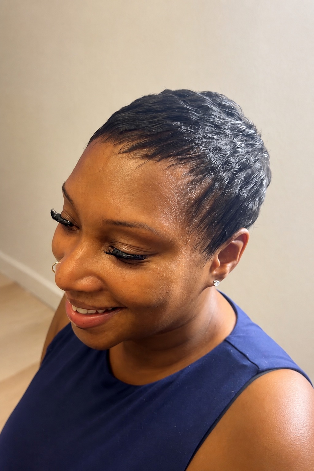Smiling client with a freshly cleaned-up and styled pixie cut